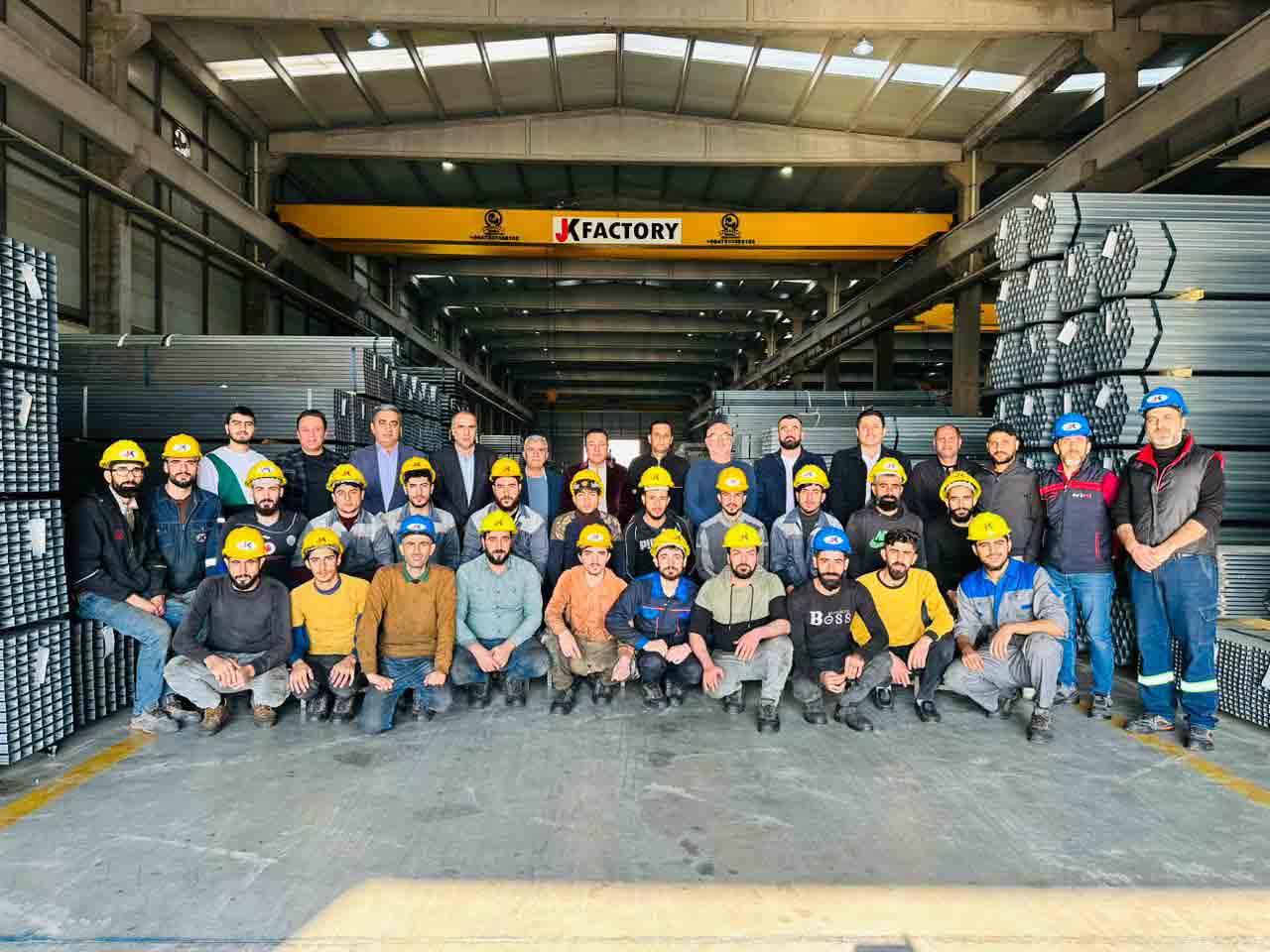 Workers and management of JK factory Image
